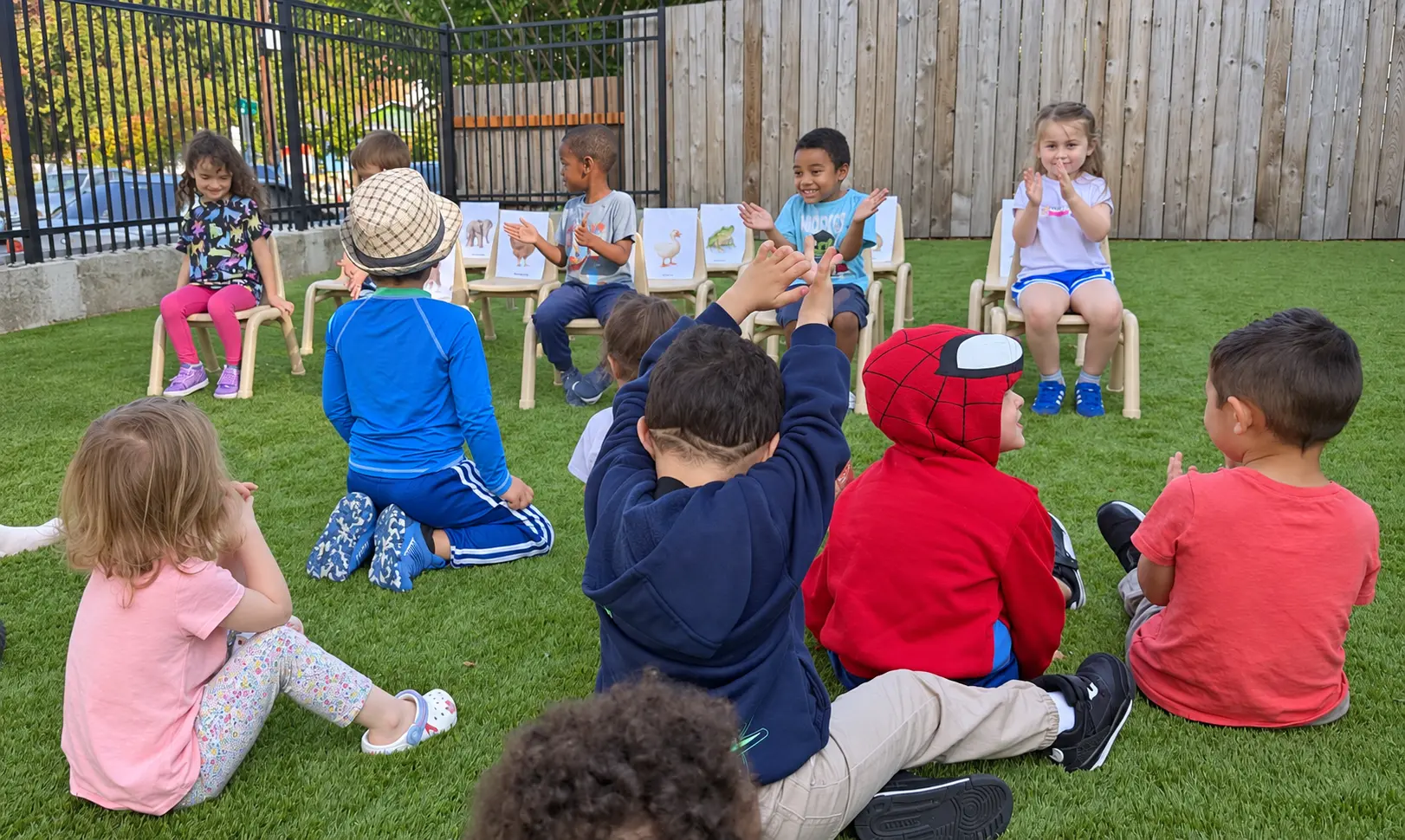Preschool children participating in a group learning activity outdoors